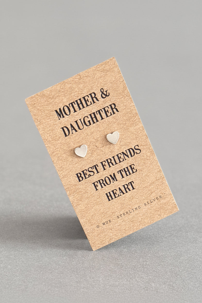Pair of heart-shaped earrings on a 'Mother & Daughter Best Friends from the Heart' card.
